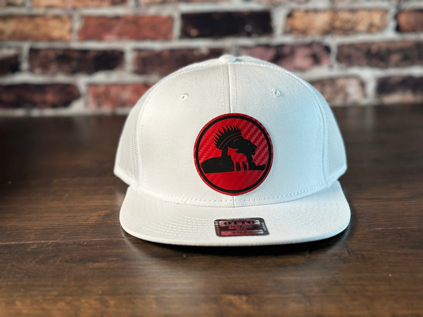 Wrath and Grace Logo Flatbill Snapback in white with carbon fiber red patch
