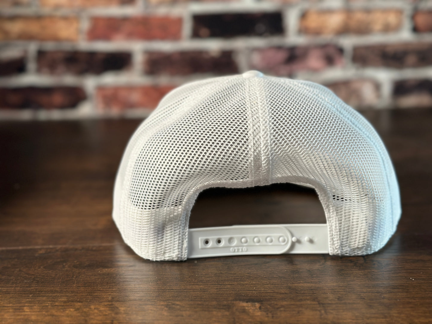 Wrath and Grace Logo Flatbill Snapback in white with carbon fiber red patch