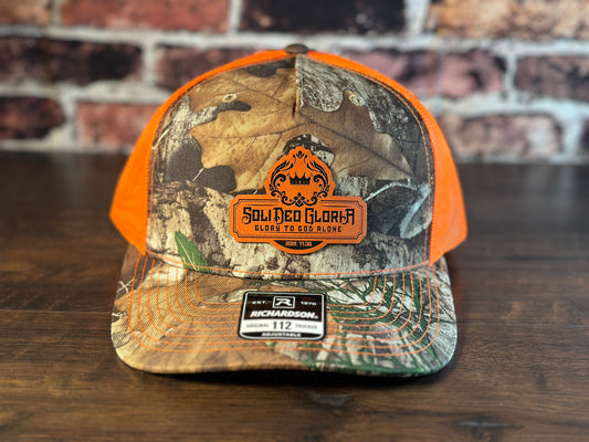 SDG Realtree Edge and Blaze Orange Trucker Hat with Orange Patch
